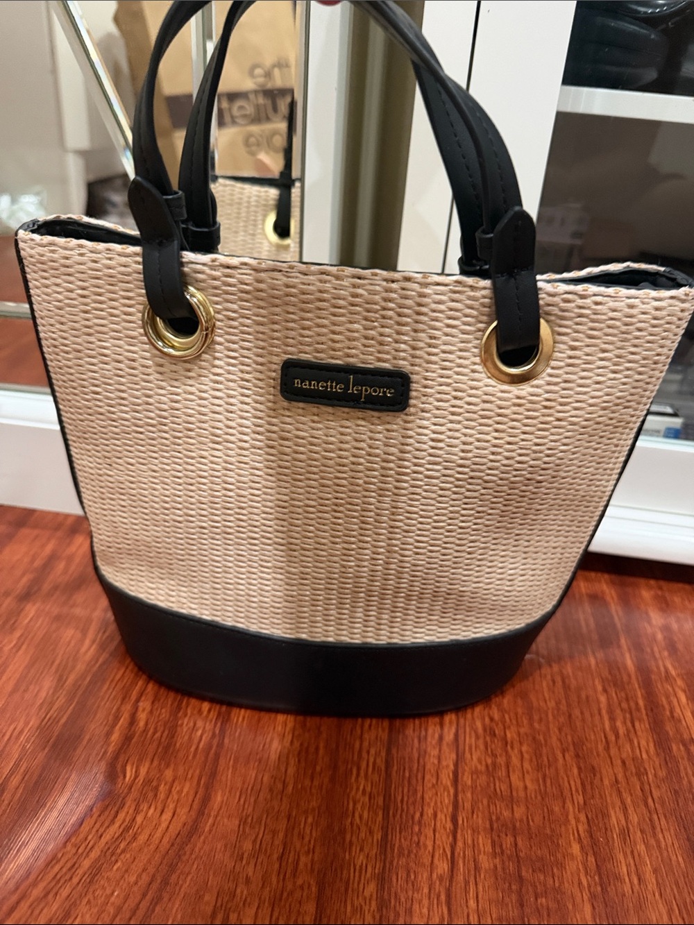 Nanette Lepore Beige and Black Straw-Style Tote with Gold Grommets